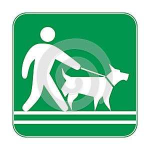 Green sign, man walking with a dog on a leash. Prohibiting and resolving signs.