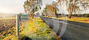 Green signboard at the roadside