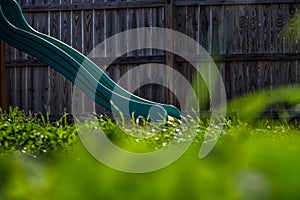 Green Slide on a Backyard Playground