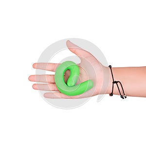 Green slime in the hands of a child on a white background