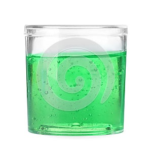 Green slime in plastic container isolated on white. Antistress toy