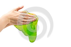 Green slime toy in woman hand isolated on white