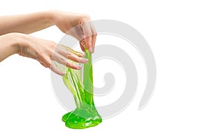 Green slime toy in woman hand isolated on white