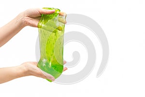 Green slime toy in woman hand isolated on white