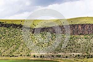 green slope of crater with Lake Nar in Cappadocia photo