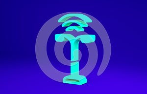 Green Smart street light system icon isolated on blue background. Internet of things concept with wireless connection