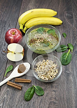 Green smoothie with apples, spinach, banana, germinated buckwheat and cinnamon.