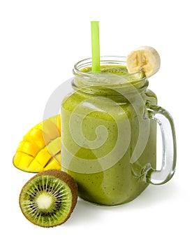 Green smoothie banana kiwi mango in glass jar isolated on white background.