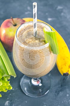 Green smoothie with celery, banana and apple