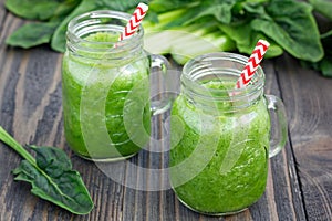 Green smoothie with celery, cucumber, spinach, apple and lemon