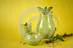 Green smoothie in glass vessels