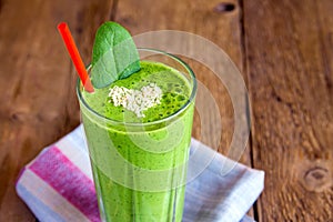 Green smoothie with heart of sesame seeds