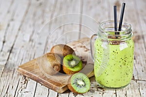 Green smoothie with kiwi, apple, lemon and linen seeds. Healthy fresh diet eating, superfood