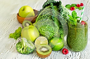 Green smoothie with lime, kiwi, savoy cabbage and broccoli