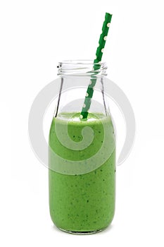 Green smoothie in a milk bottle isolated on white