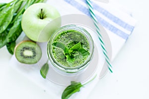 Green smoothie with spinach and apple. Summer and vegan foods and drinks concept.