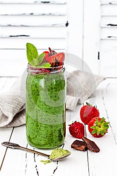 Green smoothie with superfoods. Matcha green tea chia seeds pudding