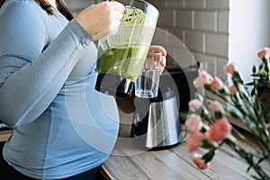 Green Smoothies Recipes For Pregnancy and Postpartum, Prenatal Nutrition. Pregnant woman preparing green vitamin