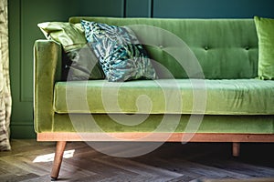 Green sofa in elegant apartment. Home staging