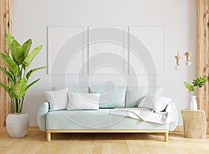 Green sofa in living room with Three frame mockup, 3D rendering