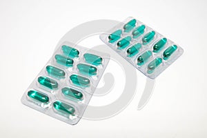 Green soft gel capsules pills in blister pack