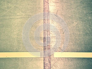 Green solid floor in a school gymnasium with black frame lines