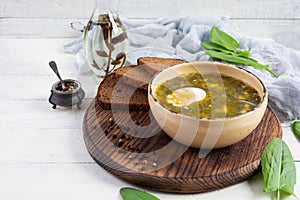 Green soup with sorrel, meat and egg. Traditional sorrel borscht