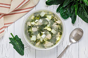 Green soup with spinach, meat, potato and egg (green borscht), top view