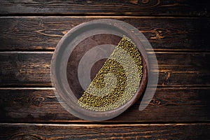 Green soybeans on wooden background, biologic agriculture