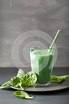 Green spinach smoothie with spirulina, chia seed, lime, apple
