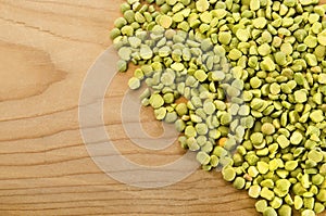 Green split pea on rustic wood