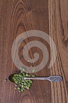 Green split peas in a teaspoon.