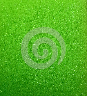 Green sponge texture. Background of sponge in green.