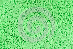 Green sponges for cleaning as a background texture