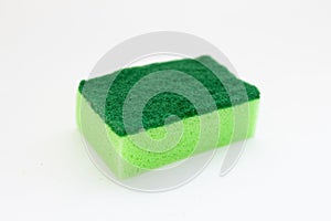 Green sponges for cleaning and washing dishes on white background