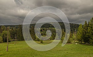 Green spring meadow near Bedrichov village in Jizerske mountains photo