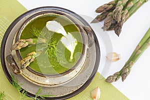 Green spring pureed asparagus soup in a bowl