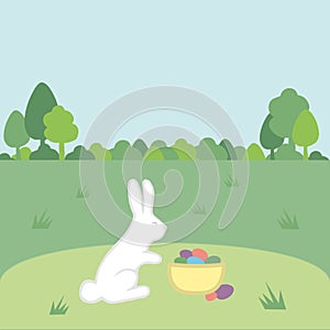 Green spring sunny lawns with white rabbit, basket with eggs, trees. Easter Greeting card, background. Copyspace for text