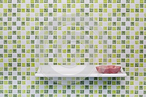 Green Square Tile Wall with Shelve and Soap Dish photo