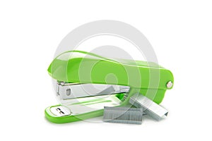 Green stapler  on a white background