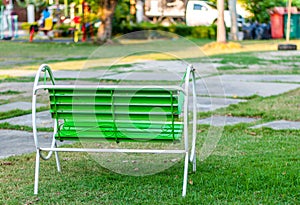 Green steel relax chair in park