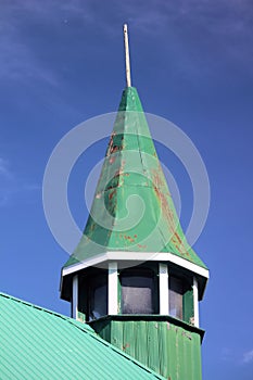 Green Steeple Tower on Town Hall Against Blue Sky