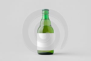 Green steinie beer bottle mockup with blank label