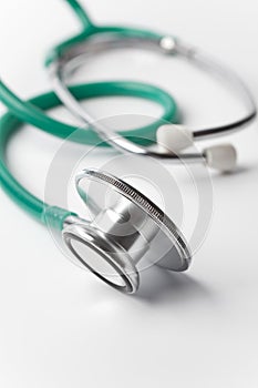 Green stethoscope on white background photo