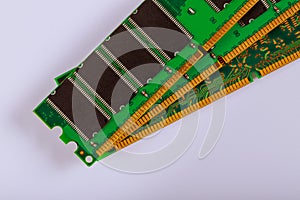 Green stick of RAM memory for computer with electronics components on computer repair space for your text photo