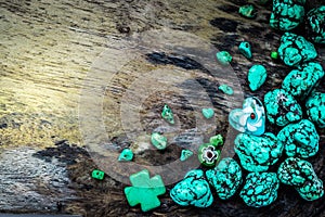 Green stone on wooden floor for background composition