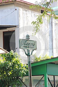 Green street name signs in the Malioboro area.