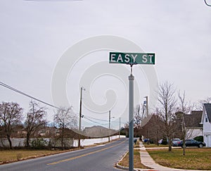 Green street sign that says, easy street