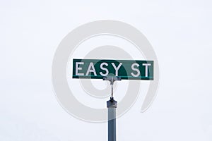 Green street sign that says, easy street