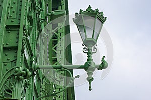 Green streetlamp on white background